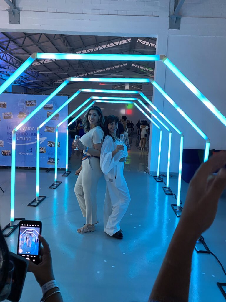 A bride and groom posing in front of a photo booth